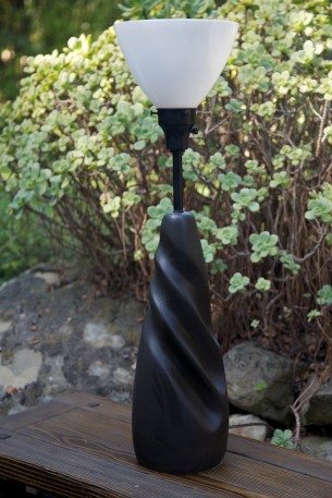 SOLD

black ceramic mid century modern table lamp with milk glass shade.
measures 29" high to top of shade.